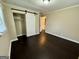 Stylish bedroom featuring a barn door closet, hardwood floors and neutral wall color at 230 Argus Cir, Atlanta, GA 30331