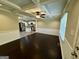 Open-concept living area flows into the kitchen, featuring dark wood floors and beamed ceilings at 230 Argus Cir, Atlanta, GA 30331