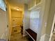 Functional mudroom with built-in bench, coat hooks, and stylish wood-look flooring at 230 Argus Cir, Atlanta, GA 30331