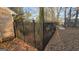 A secure black metal fence surrounds the property, offering privacy and a classic look at 1006 Harbor View Ln, Mcdonough, GA 30252