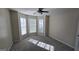 Bedroom with a ceiling fan and windows for natural light at 1006 Harbor View Ln, Mcdonough, GA 30252