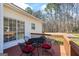 Inviting back deck featuring outdoor seating, ideal for relaxation and enjoying views of the surrounding greenery at 1191 Rawlings Dr, Rutledge, GA 30663