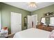 Bedroom features green walls, plush carpeting and traditional furnishings at 1191 Rawlings Dr, Rutledge, GA 30663