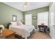 Comfortable bedroom with green walls, a large bed, and lots of natural light at 1191 Rawlings Dr, Rutledge, GA 30663