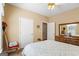 Neutral bedroom with plush carpet, a floral comforter and ensuite bathroom at 1191 Rawlings Dr, Rutledge, GA 30663