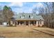 Charming brick home featuring a welcoming front porch and a well-maintained front yard at 1191 Rawlings Dr, Rutledge, GA 30663