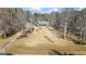 Aerial view of a home featuring a long driveway and a large front lawn surrounded by trees at 1191 Rawlings Dr, Rutledge, GA 30663