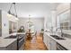 Bright kitchen with white cabinets, marble countertops, and modern stainless steel appliances at 1191 Rawlings Dr, Rutledge, GA 30663