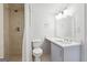 Bathroom featuring tiled shower, toilet, vanity with white counter at 131 Heron Dr, Riverdale, GA 30274