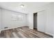 Bedroom featuring sleek wood floors, window and closet at 131 Heron Dr, Riverdale, GA 30274