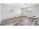 Bedroom with neutral walls, two windows, and contemporary flooring at 131 Heron Dr, Riverdale, GA 30274