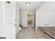 Inviting foyer featuring tile flooring, staircase, and entry to the living area with stylish wood floors at 131 Heron Dr, Riverdale, GA 30274