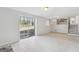 Living room with tile floors and sliding glass door to the outside at 131 Heron Dr, Riverdale, GA 30274