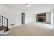 Living room with stone fireplace, wood-look tile floors, and open staircase at 131 Heron Dr, Riverdale, GA 30274