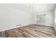 Bright living room with wood flooring, decorative ceiling feature, and a seamless transition to other spaces at 131 Heron Dr, Riverdale, GA 30274