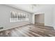 Bright living room with wood flooring, decorative ceiling feature, and a large window with natural light at 131 Heron Dr, Riverdale, GA 30274