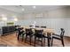 Dining room with long table, wainscotting and wood floors at 105 Roundleaf Ct, Peachtree City, GA 30269