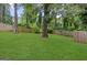 Spacious backyard with lush green grass and a wood fence providing privacy and a natural backdrop at 1077 Peeples Sw St, Atlanta, GA 30310