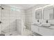 Updated bathroom with tiled shower, modern vanity, and sleek fixtures at 1077 Peeples Sw St, Atlanta, GA 30310