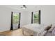 Bedroom featuring hardwood floors, a ceiling fan, and natural light at 1077 Peeples Sw St, Atlanta, GA 30310