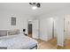 Bedroom with hardwood floors, ceiling fan, and access to other rooms at 1077 Peeples Sw St, Atlanta, GA 30310