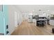 Bright, open kitchen with modern appliances, island seating, and gorgeous wood flooring at 1077 Peeples Sw St, Atlanta, GA 30310
