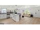 Bright and open living space with hardwood floors, an island kitchen, and ample natural light at 1077 Peeples Sw St, Atlanta, GA 30310