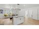 Open concept living space featuring a kitchen island, comfortable seating, and modern finishes at 1077 Peeples Sw St, Atlanta, GA 30310