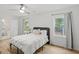Bright main bedroom with hardwood floors, natural light, and a view to the bathroom at 1077 Peeples Sw St, Atlanta, GA 30310