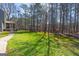 Spacious backyard with lush lawn and mature trees at 707 Orleans Trce, Peachtree City, GA 30269