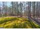 Beautiful backyard featuring a wooded area and open green space at 707 Orleans Trce, Peachtree City, GA 30269