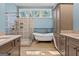 Elegant bathroom featuring a frameless shower, standalone tub, and custom cabinetry at 707 Orleans Trce, Peachtree City, GA 30269