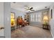 Neutral bedroom with a ceiling fan, bright window with shutters, and a cozy design at 707 Orleans Trce, Peachtree City, GA 30269