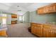 View of the bonus room with built in cabinets, carpeting and ceiling fan at 707 Orleans Trce, Peachtree City, GA 30269