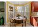 Charming breakfast nook with large bay windows, a chandelier, and views of the outdoors at 707 Orleans Trce, Peachtree City, GA 30269