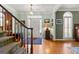 Inviting foyer with hardwood floors, staircase, and access to various living spaces at 707 Orleans Trce, Peachtree City, GA 30269