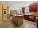 Sunlit kitchen with center island and eat-in nook in the background at 707 Orleans Trce, Peachtree City, GA 30269