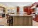 Kitchen island with granite countertops and eat-in breakfast nook at 707 Orleans Trce, Peachtree City, GA 30269