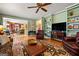 Bright living room showcasing seamless flow into kitchen and dining area at 707 Orleans Trce, Peachtree City, GA 30269