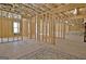 Unfinished basement featuring exposed wood framing, providing a blank canvas for customization and future living space at 135 Red Maple Dr, Peachtree City, GA 30269