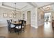 Large dining room features hardwood floors, coffered ceiling, and space for a large dining table at 135 Red Maple Dr, Peachtree City, GA 30269