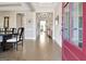 Elegant entryway with hardwood floors, a coffered ceiling, and a view of the dining room at 135 Red Maple Dr, Peachtree City, GA 30269