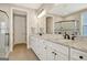 Stylish bathroom featuring granite countertops, double sinks, and glass-enclosed shower at 135 Red Maple Dr, Peachtree City, GA 30269