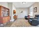 Cozy sitting area with wood accents, arm chairs, hardwood floors, and natural light at 135 Red Maple Dr, Peachtree City, GA 30269