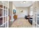 Comfortable sitting room featuring arm chairs, hardwood floors, and natural light at 135 Red Maple Dr, Peachtree City, GA 30269