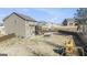 Large fenced backyard featuring a raised deck, patio, and space for outdoor recreation at 157 Donovan Ave, Locust Grove, GA 30248