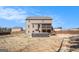 Spacious fenced backyard featuring a raised deck, patio, hot tub and play set at 157 Donovan Ave, Locust Grove, GA 30248