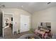 The bonus room includes pink tables and toys on a soft carpet at 157 Donovan Ave, Locust Grove, GA 30248
