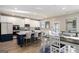 Bright eat-in kitchen with white cabinets, stainless steel appliances and a blue island with seating at 157 Donovan Ave, Locust Grove, GA 30248