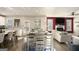 Open-concept living room and kitchen offer lots of natural light; hardwood flooring throughout at 157 Donovan Ave, Locust Grove, GA 30248